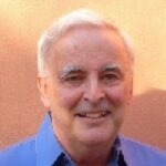 Dr Mark Tucker portrait of white-haired man